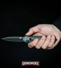 Smith & Wesson Spring Assisted Finger Actuator Spear Point OTF - Black Serr -Knivesand Tools Shop MP OTF Spring Assisted Spear Point Knife Gray Black BHQ 80731 kp in hand web large 1